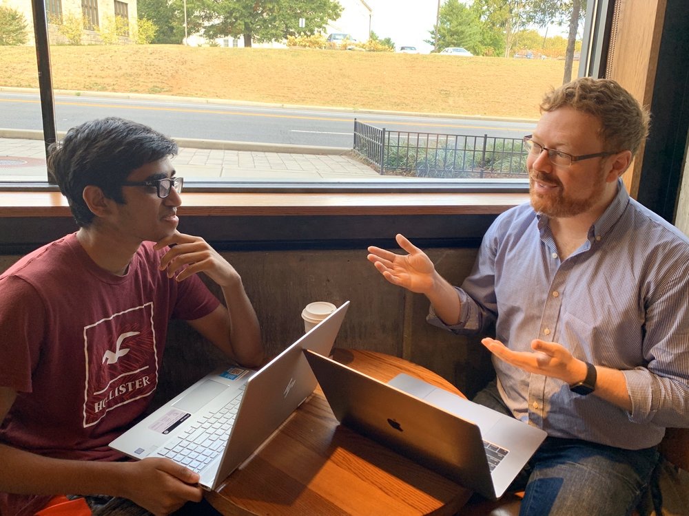 Matt Schwartz working with a student on their college essay